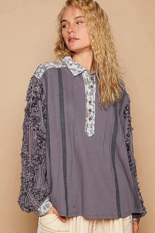 This beautiful blouse features a floral print and delicate lace detailing for a feminine touch. The half-button design adds a stylish and versatile element to the top. With long sleeves, this blouse is perfect for adding a touch of elegance to your outfit while keeping you warm. Elevate your wardrobe with this chic and romantic piece.