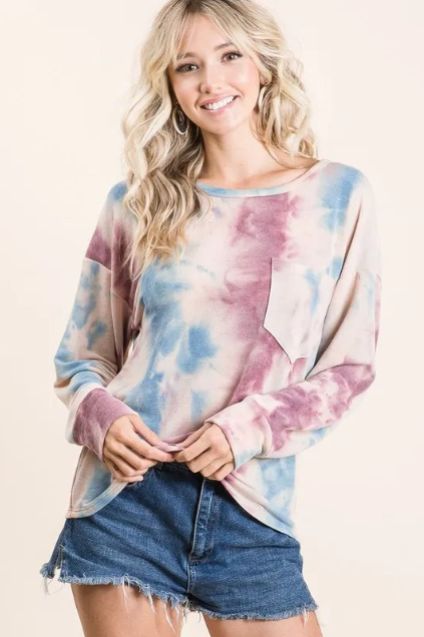 Pastel tie dye long sleeve top in soft watercolor shades paired with denim for an effortless casual style.