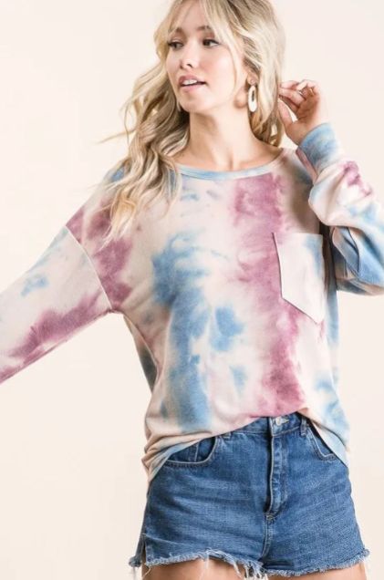 Pastel tie dye long sleeve top styled with a denim skirt showing the comfortable oversized silhouette for everyday wear.