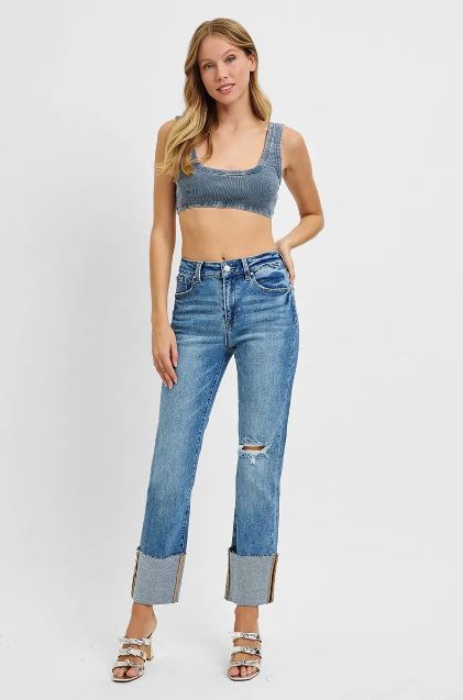 Risen high rise cuffed straight jeans styled with a cropped top for an elevated casual look.