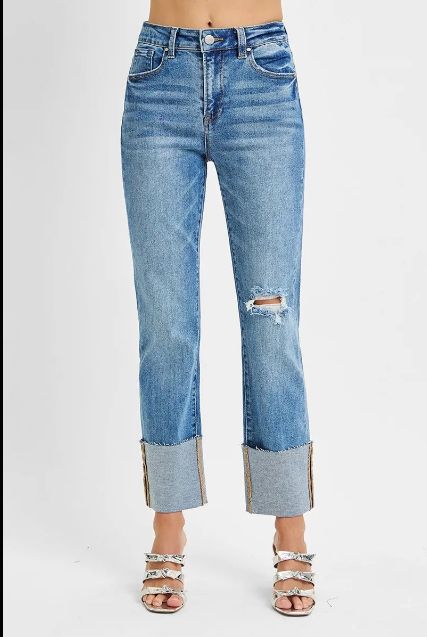 High rise Risen jeans with a relaxed straight leg, wide cuffed hem, and light knee distress.
