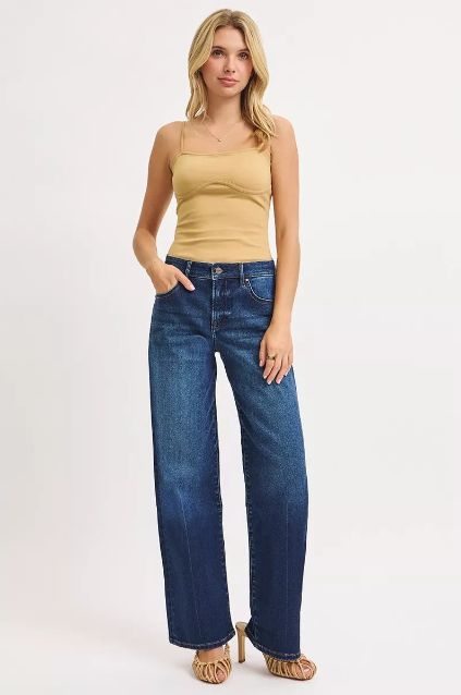 Risen high rise wide leg jeans styled with a fitted top for an elevated everyday look.