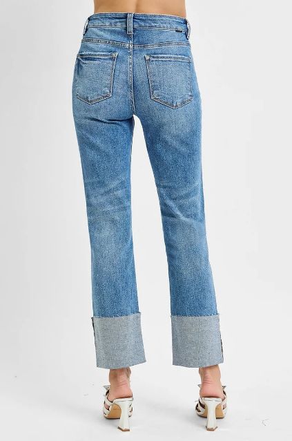 Back view of Risen straight leg jeans with a relaxed fit and wide rolled cuffs.